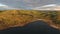 Dwarf birch, moss-covered stones. A large lake in Russia, Murmansk region, Kola Peninsula