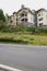 Dwelling buildings on hilltop by asphalt road