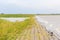 Dyke dike mudflat waves landscape North Sea coast Nordenham Germany