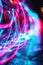 Dynamic abstract neon swirls with a bokeh effect in pink and blue, creating a sense of digital motion, perfect for