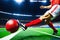 Dynamic Action: Man\\\'s Foot Hitting Football in Stadium Showdown