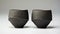 Dynamic Angles: Carved Surfaces And Warm Tonal Range In Black Glasses