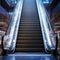 Dynamic ascent Modern escalator in bustling shopping haven, sleek design