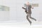 Dynamic businessman jumping outdoor