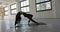 Dynamic camera movement on woman doing yoga in industrial interior