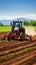 Dynamic Farming: Red Tractor Ploughing Rich Soil, Sprouting Crops