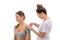 dynamic functional bandage with taping. female specialist glues kinesio tapes on the shoulder of woman