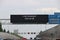 Dynamic information panel above motorway A13 with text to do the rememberance day silence at Parking lot