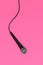 Dynamic microphone on pink background. Mic