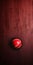Dynamic Red Cricket Ball On Red Wall - Uhd Wallpaper