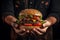 A dynamic shot of a hand holding a Portobello mushroom burger, with ingredients falling gracefully from above, highlighting the