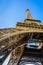 Dynamic view from below of the Eiffel Tower against blue sky