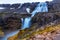 Dynjandi foss cascade waterfall with mossy canyon in the foreground, West Iceland