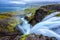 Dynjandi waterfall, Iceland, amazing landscape. Stunning view of falling water in the canyon from the top to Dynjandisvogur bay