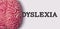 dyslexia word next to a human brain model