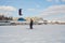 Dzerzhinsk, Nizhny Novgorod region, Russia, 03.21.2021 Speedriding skiing with a wing over your head. Spring blue sky gusty wind s