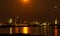 DÃ¼sseldorf and the Rhine Tower under the full moon in an orange shade