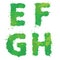 E, F, G, H, Handdrawn english alphabet - letters are made of green watercolor, ink splatter, paint splash font. Isolated on white