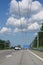 E-Highway with electric overhead contact wire for hybrid trucks, test track in Luebeck, Germany, blue sky with clouds, copy space