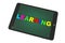E-learning Concept. Tablet PC with Learning sign