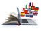 E-learning or online translator concept. Learning languages online. Laptop, book and flags.