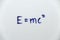 E=mcÂ² written on a white board. The famous equation of Energy equals mass times the speed of light squared by Albert Einstein