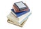 E-reader with blurred text on stack of printed books