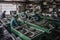 e-waste recycling facility, with workers sorting through and repairing old electronics