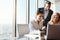 They each have their perspective to share. a group of businesspeople working together on a laptop in an office.