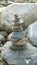 On each other stratified, stacked pebble stones, stones meditation