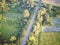 Eagle eye view of railway running on the outskirts of Zagreb city along forested area and agricultural fields, photographed with