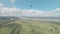 Eagle flies over valley with curved river and mirror lake