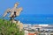 Eagle guards the gate to Bahai Gardens and overlooks the cityscape and coast of Haifa