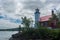 Eagle Harbor Lighthouse stands above a rocky entrance to Eagle Harbor