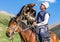 Eagle Hunter holds his eagles on horseback