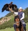 Eagle Hunter holds his eagles on horseback, ready to take flight