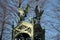 Eagle sculptures on top of  the roof of a mausoleum at Invalidenfriedhof