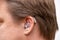 Ear close up with hearing aid