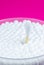 Ear cotton swabs on the pink background. Hygienic ears sticks