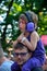 Ear-protection, Father with his child with big purple headphones