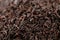 Earl Grey black loose tea leaves background