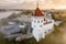 earlier foggy morning and aerial panoramic view on medieval castle and promenade overlooking the old city and historic buildings