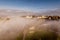 earlier foggy morning and aerial panoramic view on medieval castle and promenade overlooking the old city and historic buildings