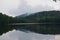 Early Autumn foliage on a misty Lake in the Adirondack Mountains of Upstate New York