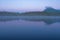 Early dawn landscape with mountain and pond