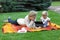 Early learning - mother watching her daughter using tablet