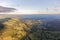 Early morning autumn sunlight creeps acrosss the Derbyshire landscape, seen from a hot air balloon.