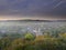 Early morning autumnal mist over East Meon village with Butser Hill and the South Downs in the background, South Downs National