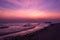 Early morning dramatic violet sky over movement blurred sea and