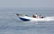 Early morning fisher men moving in sea on speedboat